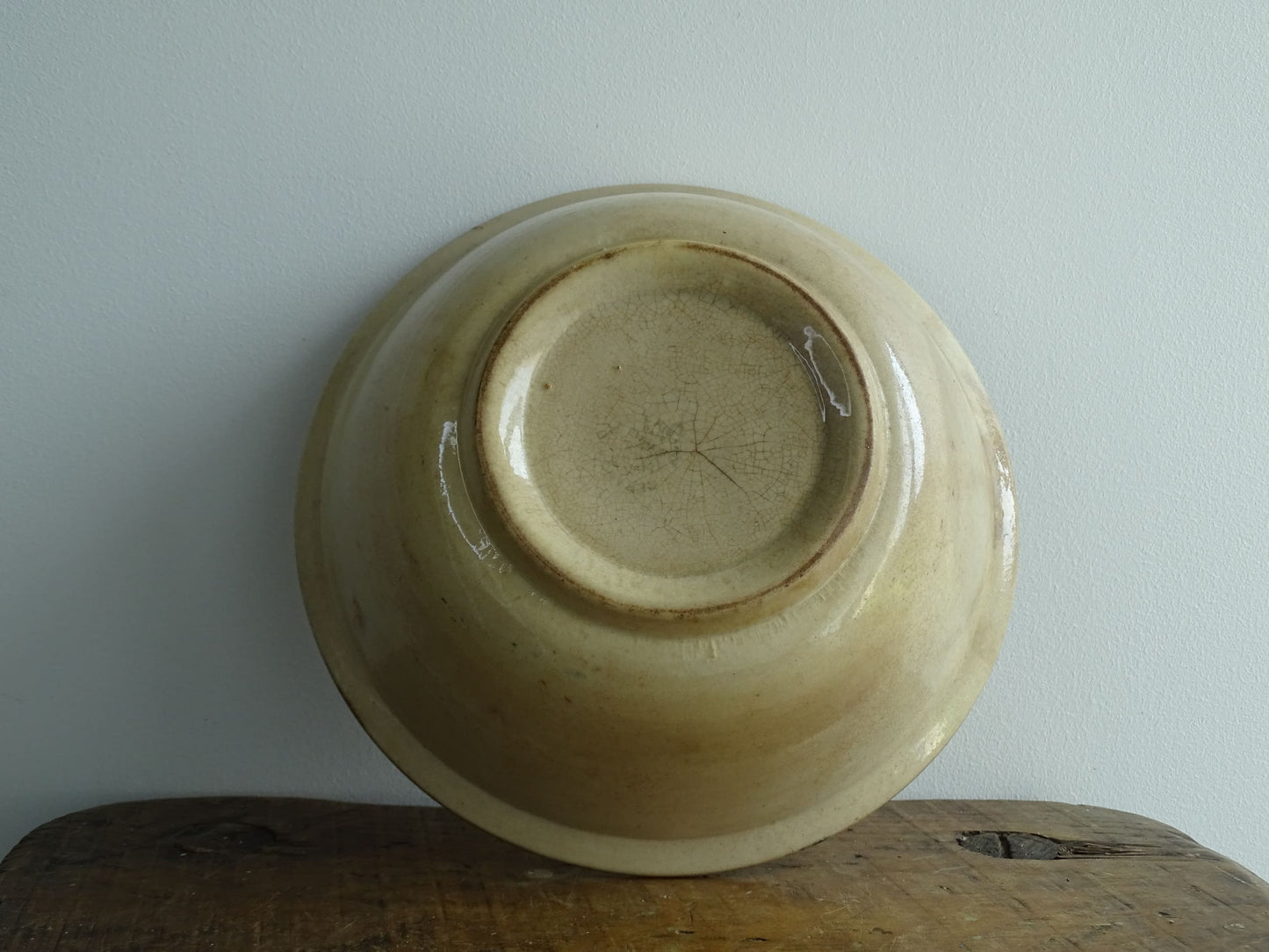 Antique Saint Amand Salad Bowl with Figure of a man and foliage and flower decoration