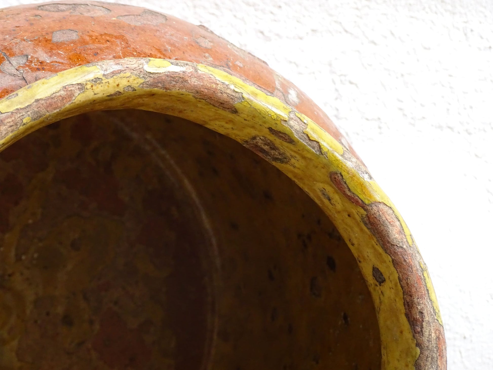 Antique French terracotta pot with brown and yellow glaze. Antique pottery pot for a rustic display.