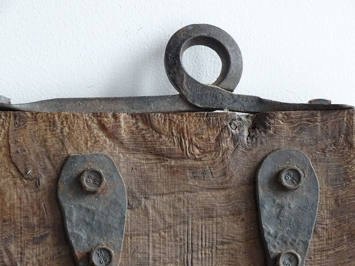 Antique Wrought Iron Hooks on Aged Wood for a French country farmhouse kitchen decor.