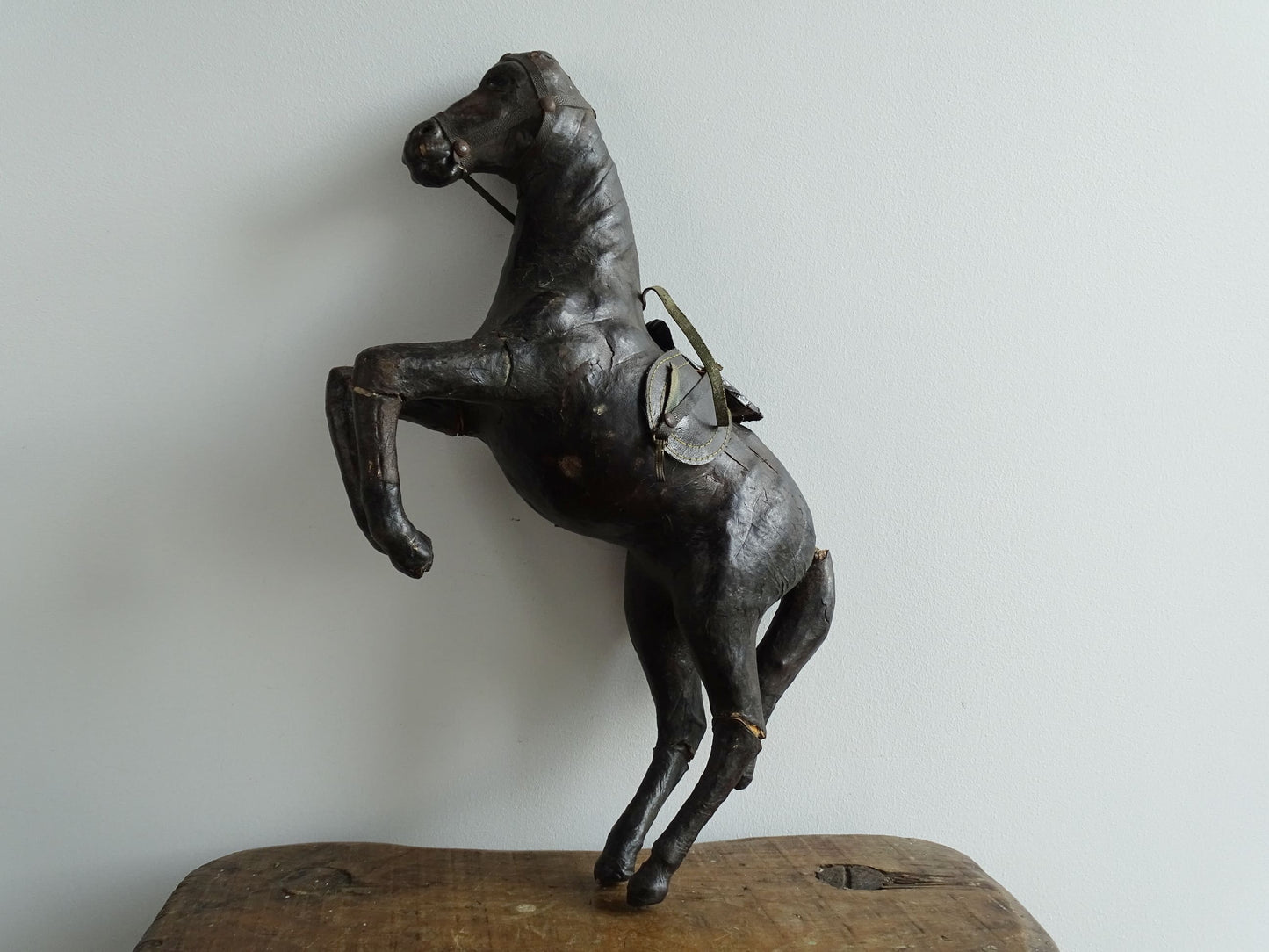 Distressed antique leather horse figurine for vintage shelf decor