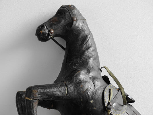 Distressed antique leather horse figurine for vintage shelf decor