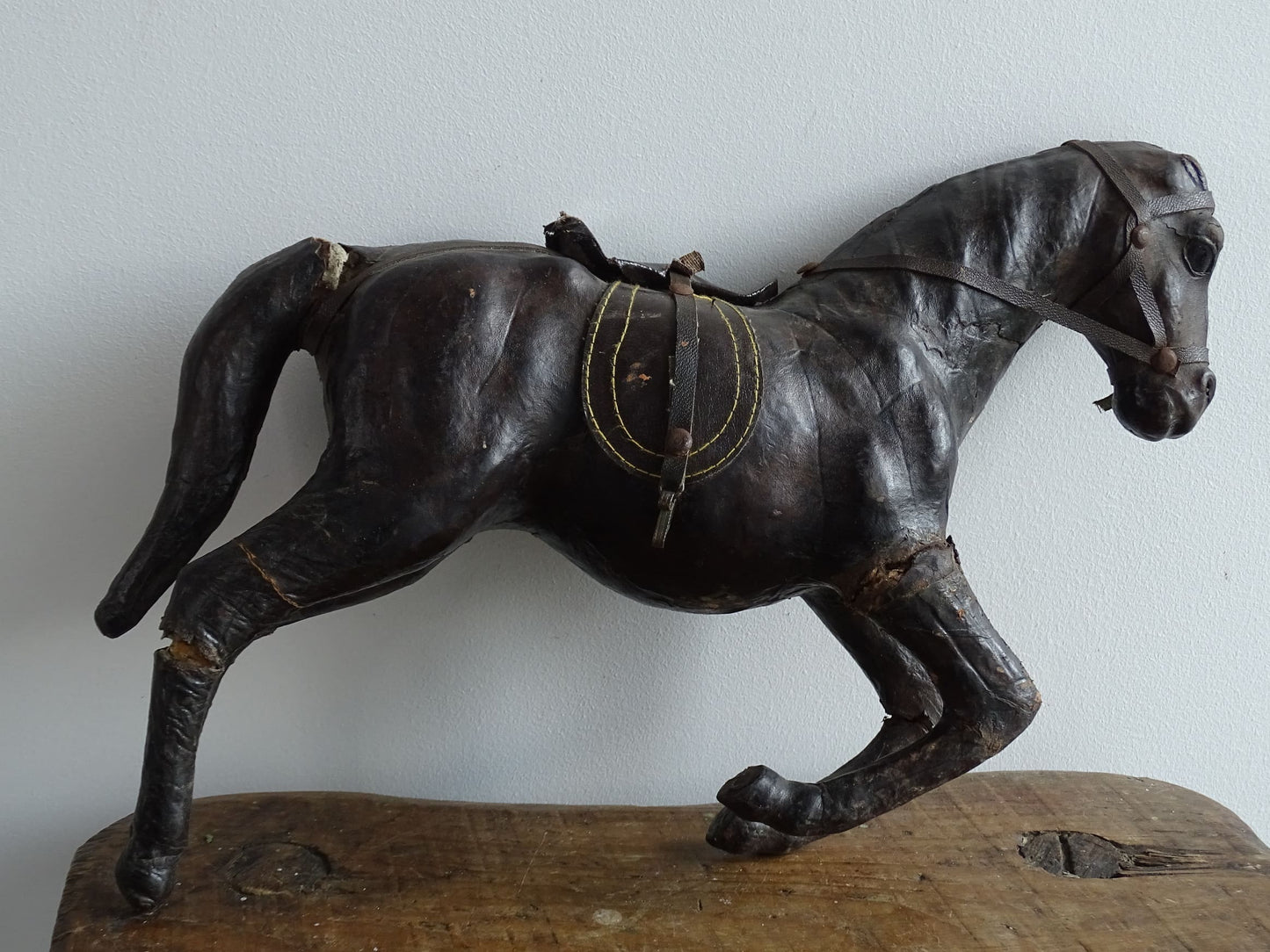 Distressed antique leather horse figurine for vintage shelf decor