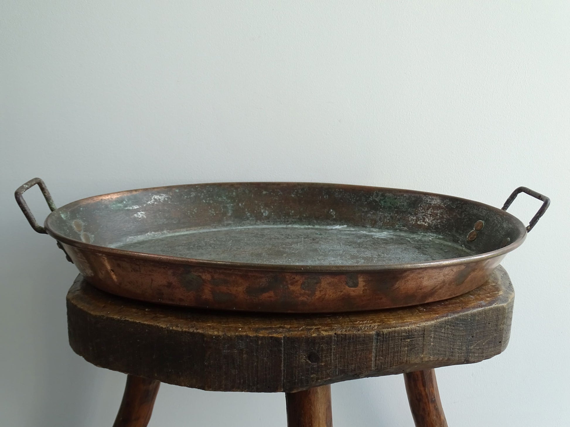 French antique copper gratin pan with two handles and tinned interior. Oval copper pan with patina.