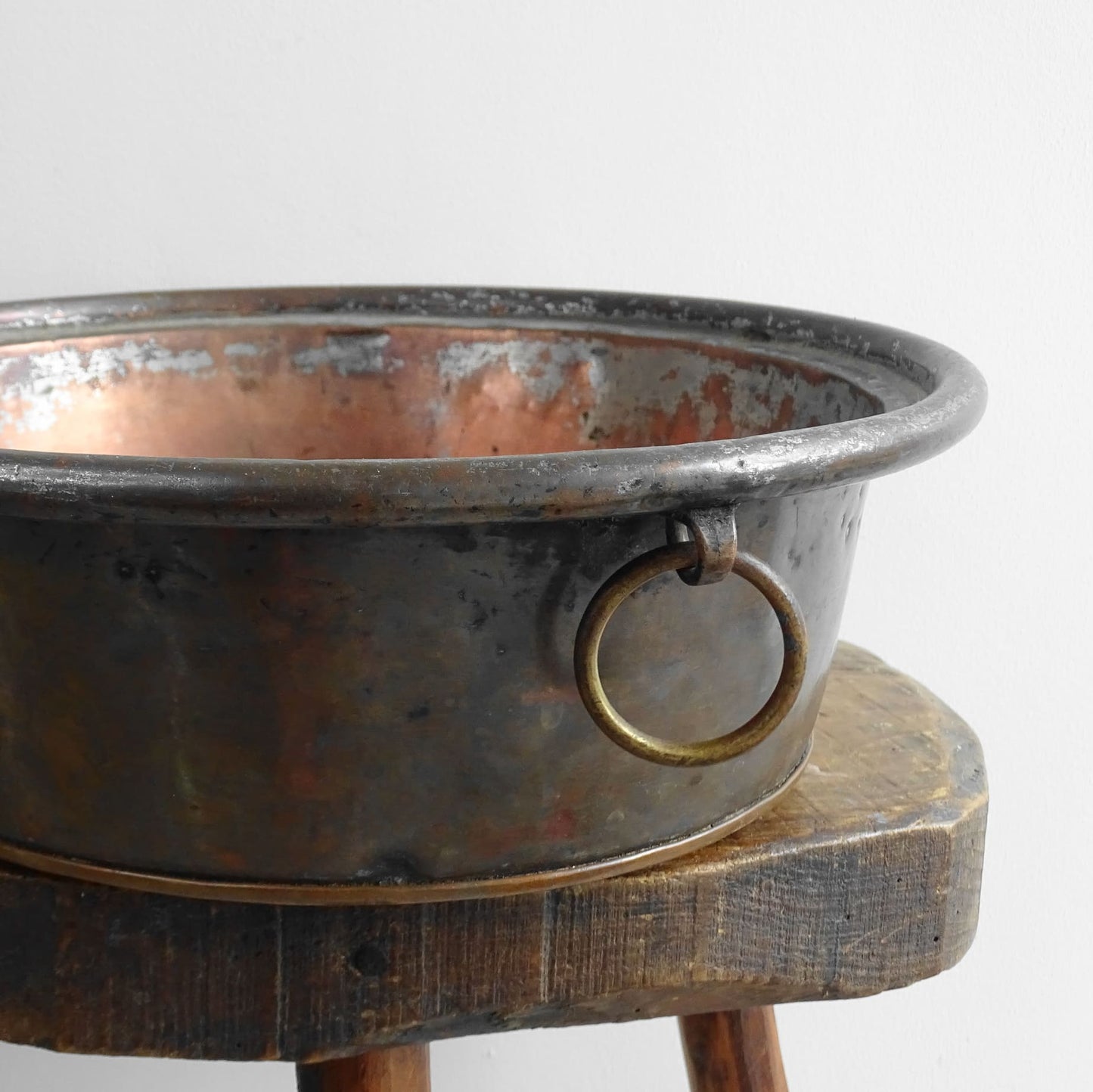 French antique copper mixing bowl with rolled top and handle. Copper bowl with timeworn appearance for a French country farmhouse kitchen.