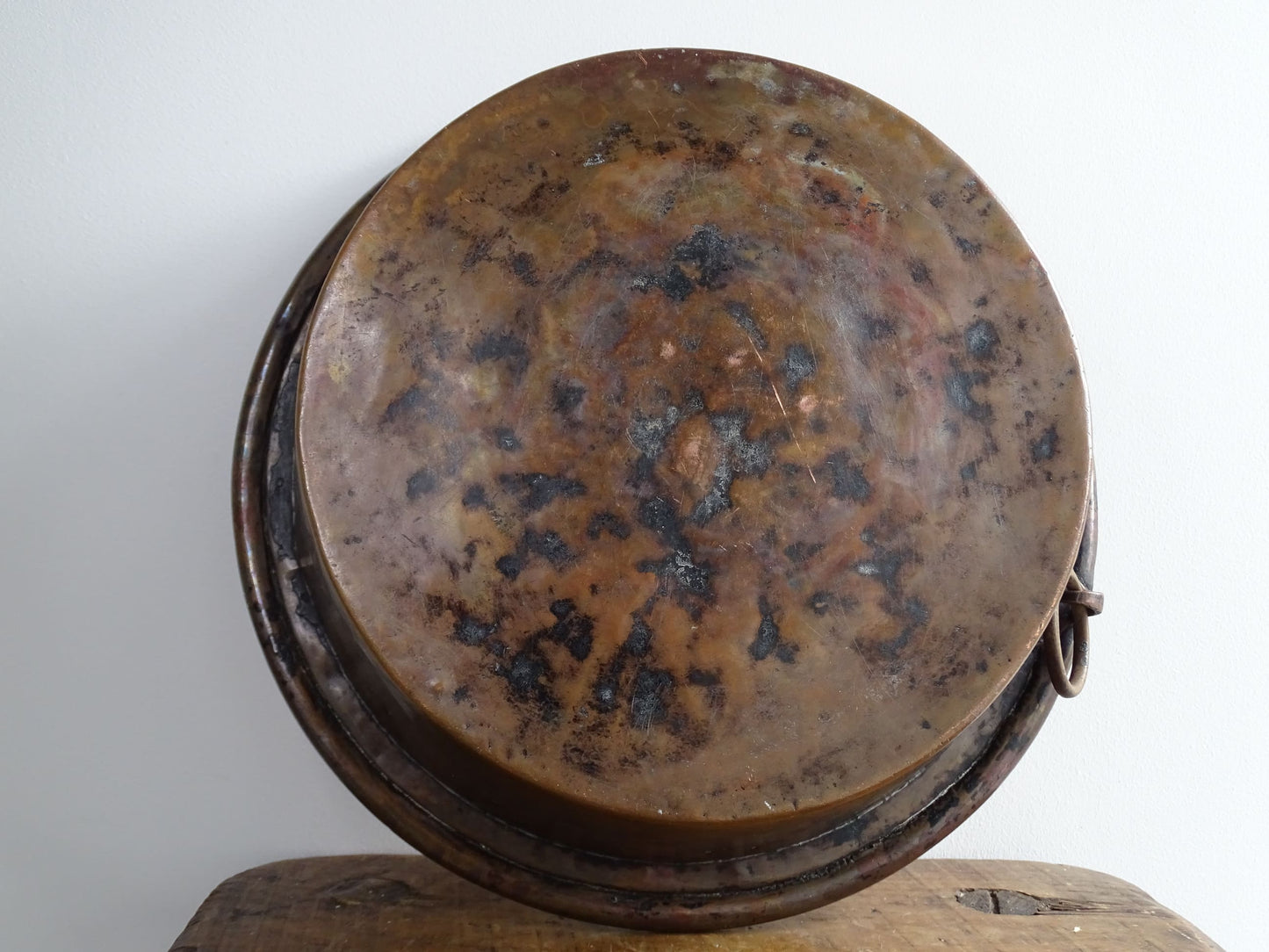 French antique copper mixing bowl with rolled top and handle. Copper bowl with timeworn appearance for a French country farmhouse kitchen.