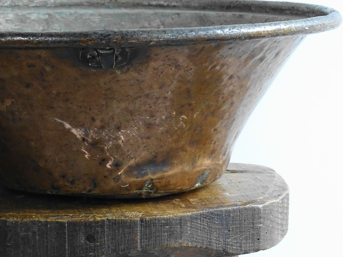 Large French antique copper bowl, it has an aged exterior with a warm patina and a tinned copper interior. It has a flared shape and substantial size. French farmhouse aesthetic decor.