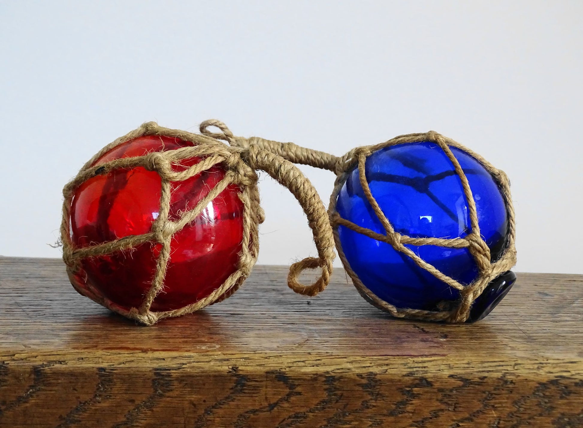 Pair of Vintage French Glass Fishing Buoys in Red and Blue