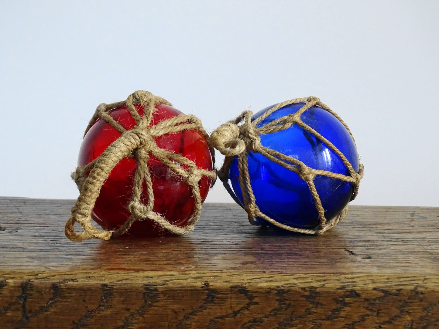 Pair of Vintage French Glass Fishing Buoys in Red and Blue